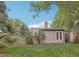 Enjoy the backyard's lush lawn, mature trees, and privacy, perfect for outdoor activities at 1582 W Briarwood Ave, Littleton, CO 80120