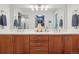 Double vanity bathroom with stylish fixtures, modern lighting and plenty of storage space at 1582 W Briarwood Ave, Littleton, CO 80120