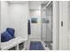 Modern bathroom with glass-enclosed shower, bench, and artistic decor at 1582 W Briarwood Ave, Littleton, CO 80120