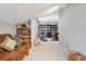 Spacious bonus room with multi-use area with living, office and exercise equipment at 1582 W Briarwood Ave, Littleton, CO 80120