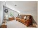 Cozy bonus room with a comfortable futon, and a peaceful window view at 1582 W Briarwood Ave, Littleton, CO 80120