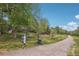 A scenic community path with mature trees and lush greenery. Enjoy outdoor walks at 1582 W Briarwood Ave, Littleton, CO 80120