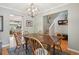 Warm dining area featuring hardwood floors and a wooden table with seating for a cozy and inviting space at 1582 W Briarwood Ave, Littleton, CO 80120