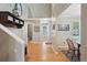 Bright entryway showcasing hardwood floors, neutral walls, and a decorative shelf with ample storage space at 1582 W Briarwood Ave, Littleton, CO 80120