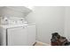 Bright laundry room featuring a modern Samsung washer and dryer set, enhancing home convenience at 1582 W Briarwood Ave, Littleton, CO 80120