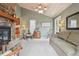 The living room features a stone fireplace, high ceilings, and adjoins the kitchen at 1582 W Briarwood Ave, Littleton, CO 80120