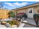 This back patio features a small rock water feature, gate, and landscaped yard at 168 S Garfield St, Denver, CO 80209