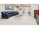 Large basement with a television, bar, and black leather sofa for your relaxation at 168 S Garfield St, Denver, CO 80209
