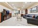 Basement area featuring recessed lighting, a bar, a television, and a leather sofa at 168 S Garfield St, Denver, CO 80209
