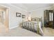 Bedroom featuring neutral walls and carpets, a bedside table and a large window to the hallway at 168 S Garfield St, Denver, CO 80209