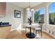 The eating nook features large bay windows and access to the kitchen at 168 S Garfield St, Denver, CO 80209