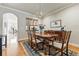 Elegant dining room with hardwood floors, classic furniture, and a view into the kitchen, ideal for meals at 168 S Garfield St, Denver, CO 80209