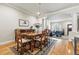 Well-lit dining area offering seamless transition into a cozy living space for relaxed gatherings and seamless entertaining at 168 S Garfield St, Denver, CO 80209