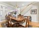 Bright dining room open to the staircase, featuring wood floors and traditional decor, providing an elegant ambiance at 168 S Garfield St, Denver, CO 80209
