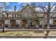 Attractive townhome with stone facade, wood doors, and wrought iron details creating an inviting curb appeal at 168 S Garfield St, Denver, CO 80209