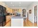 A kitchen with maple cabinets, granite countertops, and a breakfast bar featuring seating at 168 S Garfield St, Denver, CO 80209