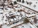 Aerial view of a residential neighborhood with houses covered in snow at 2615 N Steele St, Denver, CO 80205