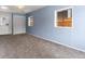 Spacious basement, carpeted, with an exterior entrance at 2615 N Steele St, Denver, CO 80205