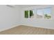 Spacious bedroom with hardwood floors and large windows at 2615 N Steele St, Denver, CO 80205