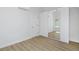 Bedroom with mirrored closet doors and hardwood floors at 2615 N Steele St, Denver, CO 80205