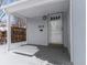 Covered front porch with white door and mailbox at 2615 N Steele St, Denver, CO 80205