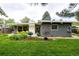 Beautifully landscaped backyard with modern patio furniture and a well-maintained lawn at 1338 S Fairfax St, Denver, CO 80222