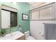 Stylish bathroom featuring a framed mirror, and modern fixtures at 1338 S Fairfax St, Denver, CO 80222