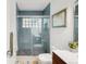 Modern bathroom features a glass enclosed tile shower and a unique vanity at 1338 S Fairfax St, Denver, CO 80222