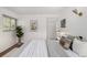 Bedroom featuring neutral decor, large windows and a decorative art piece at 1338 S Fairfax St, Denver, CO 80222