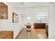 Dining area with hardwood floors, a round table, and kitchen views at 1338 S Fairfax St, Denver, CO 80222