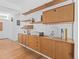 Dining room with built-in shelving, hardwood floors, and a sleek modern design at 1338 S Fairfax St, Denver, CO 80222