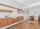 Dining room with built in shelves, hardwood floors, and designer light fixture at 1338 S Fairfax St, Denver, CO 80222