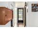 Bright entryway with wood floors leading to a main door with a unique glass design at 1338 S Fairfax St, Denver, CO 80222