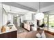 Bright kitchen with modern appliances and sleek countertops, adjoined with a seating area at 1338 S Fairfax St, Denver, CO 80222