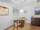 Charming kitchen nook with hardwood floors and mid-century modern furniture at 1338 S Fairfax St, Denver, CO 80222