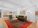 Spacious living room featuring hardwood floors, contemporary furnishings and stylish decor at 1338 S Fairfax St, Denver, CO 80222