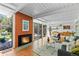 Cozy living room showcasing a fireplace, large windows, and an inviting seating area at 1338 S Fairfax St, Denver, CO 80222