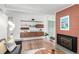 Comfortable living room with a fireplace, hardwood floors, and a view of the backyard at 1338 S Fairfax St, Denver, CO 80222