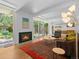 Bright living room with wood floors, modern furniture, and cozy fireplace at 1338 S Fairfax St, Denver, CO 80222