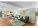 Spacious living room with hardwood floors, stylish decor, and ample natural light at 1338 S Fairfax St, Denver, CO 80222