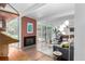 Bright living room with a fireplace and large sliding glass doors that bring in plenty of natural light at 1338 S Fairfax St, Denver, CO 80222