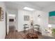 Bright living room with natural lighting, neutral decor, and skylight at 1338 S Fairfax St, Denver, CO 80222