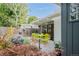View of the patio with a bright dining set, landscaped garden and outdoor living space at 1338 S Fairfax St, Denver, CO 80222