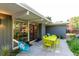 Comfortable outdoor patio space with seating arrangements and a well-manicured garden at 1338 S Fairfax St, Denver, CO 80222