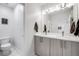 Well-lit bathroom features double vanity, modern fixtures, and a spacious layout at 2922 W 26Th Ave # 1, Denver, CO 80211