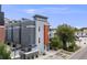 Three story grey home with an orange section next to the front door, with parking in the back at 2922 W 26Th Ave # 1, Denver, CO 80211