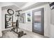 Bright home gym featuring workout equipment, a wall mirror, and sleek laminate flooring at 2922 W 26Th Ave # 1, Denver, CO 80211