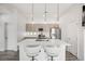 Bright kitchen features an island with seating, stainless appliances, and lots of natural light at 2922 W 26Th Ave # 1, Denver, CO 80211