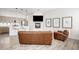 A spacious living room showcasing the open-concept with the kitchen, fireplace, and comfortable seating at 2922 W 26Th Ave # 1, Denver, CO 80211