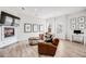 Living room features a fireplace with mantel and ample natural light at 2922 W 26Th Ave # 1, Denver, CO 80211